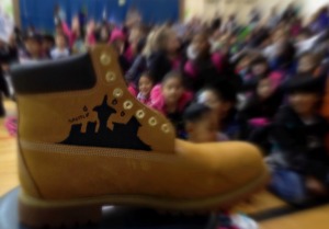 City Year Timberland boot featuring Seattle skyline at the pep rally.